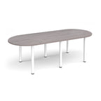Oval table with grey wood-effect top and white metal legs on a white background