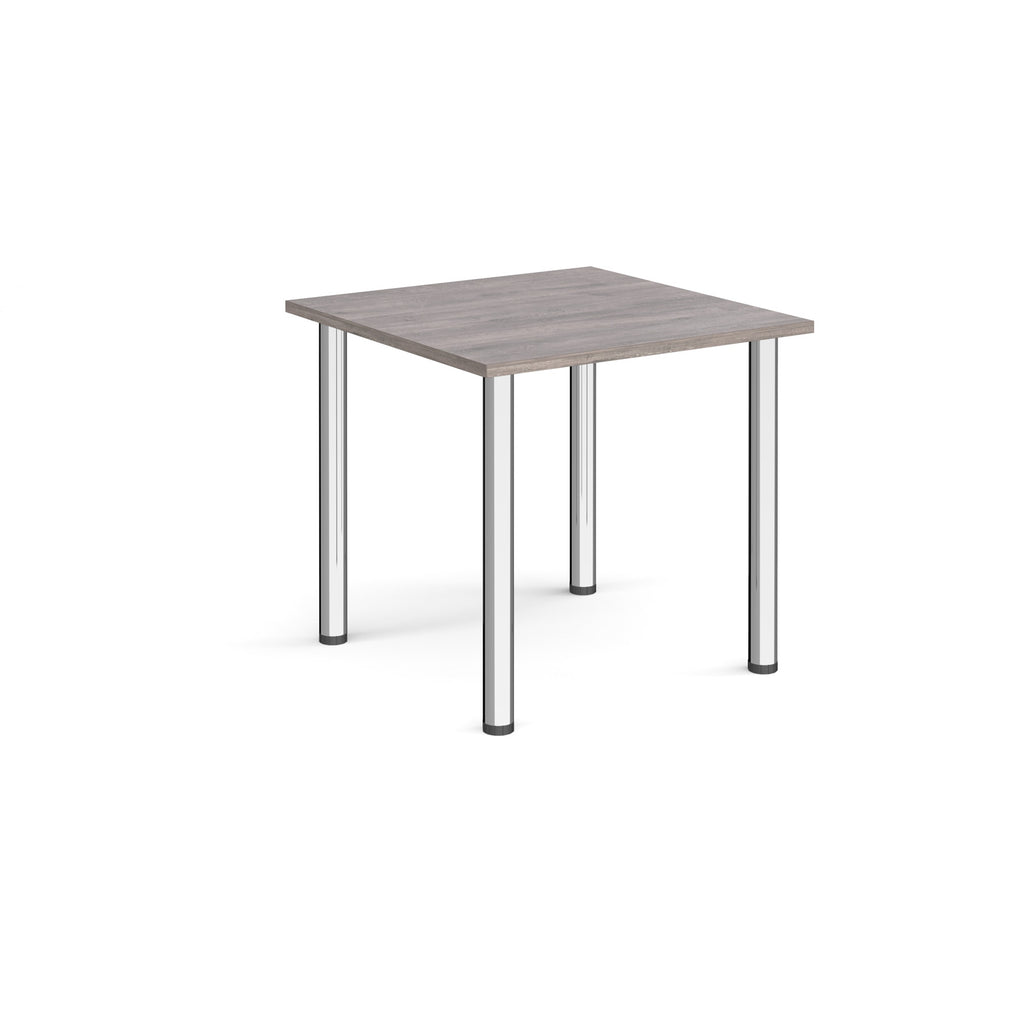 Square table with a grey wood-effect top and metal legs on a white background