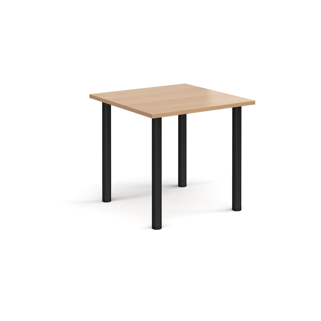 Square table with wood-effect top and black legs on a white background