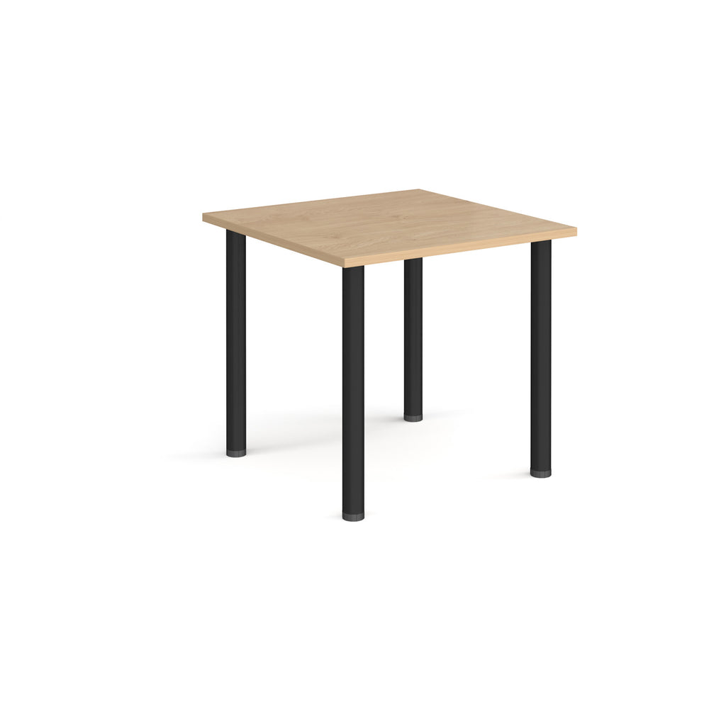 Square table with wood-effect top and black legs on a white background