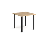 Square table with wood-effect top and black legs on a white background