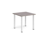 Square table with grey wood-effect  top and silver metal legs on a white background