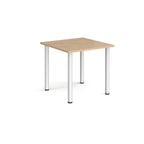 Square table with wood-effect top and silver metal legs on a white background