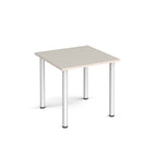 Square table with light grey top and silver metal legs on a white background