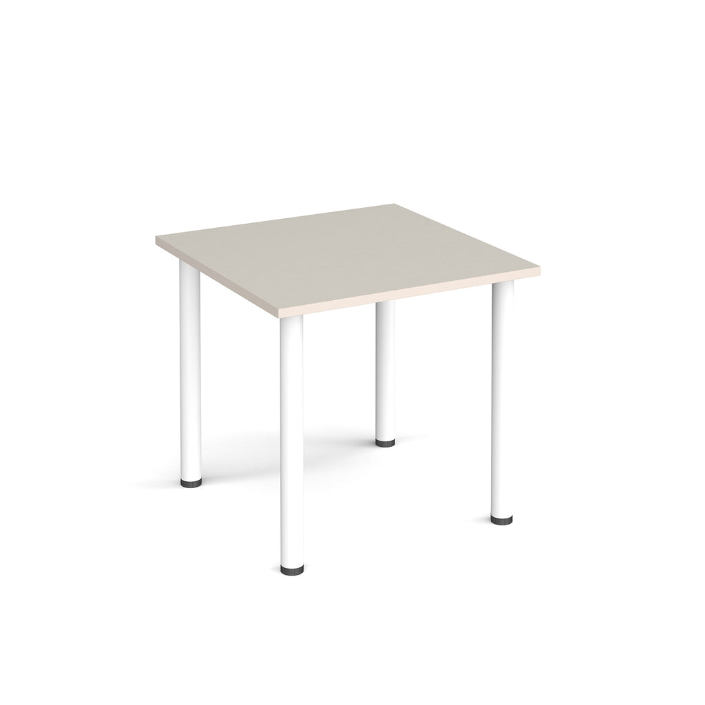 Square table with light grey top and white legs on a white background