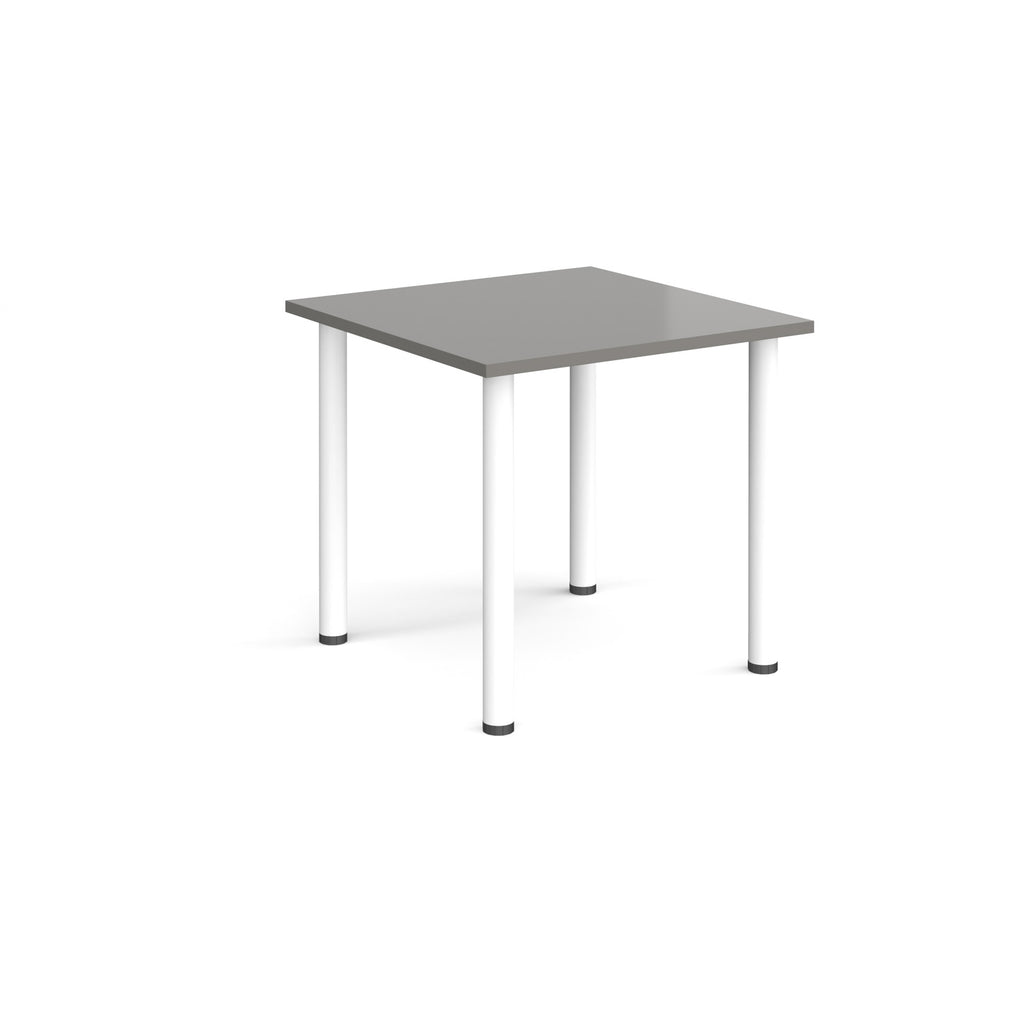 Square table with grey top and white legs on a white background