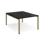 Back-to-back desk with black top and green metal frame on a white background
