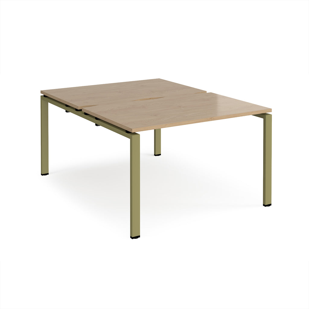 Back-to-back desk with wood-effect top and green metal frame on a white background