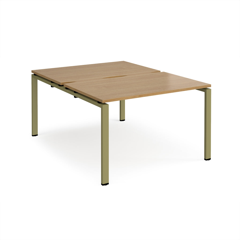 Back-to-back desk with wood-effect top and green metal frame on a white background