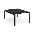 Black back-to-back desk with metal frame on a white background