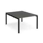 Back-to-back desk with grey top and black metal frame on a white background