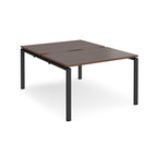 Back-to-back desk with wood-effect top and black metal frame on a white background