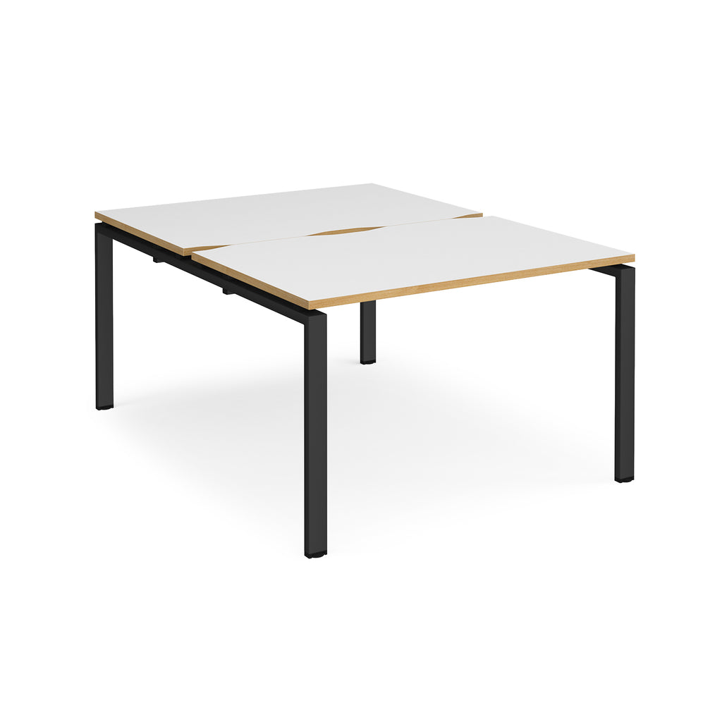 Back-to-back desk with white top with wooden edges and black metal frame on a white background