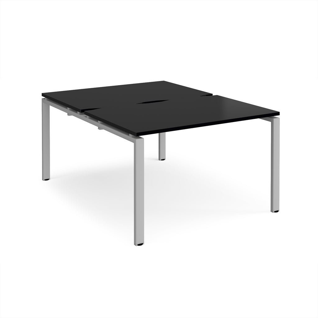 Back-to-back desk with black top and silver metal frame on a white background
