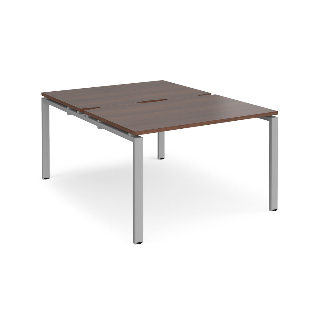 Back-to-back desk with wood-effect top and silver metal frame on a white background