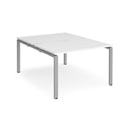 Back-to-back desk with white top and silver metal frame on a white background