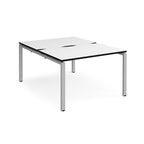 Back-to-back desk with white top with black edges and silver metal frame on a white background