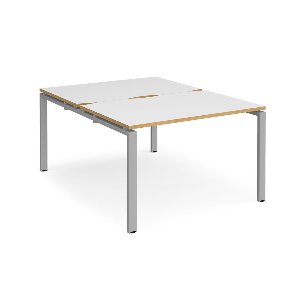 Back-to-back desk with white top with wooden edges and silver metal frame on a white background