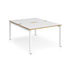 Back-to-back desk with white top with wooden edges and white metal frame on a white background