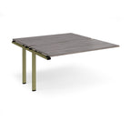 Desk add-on unit with grey wood-effect top and green metal frame on a white background