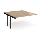 Desk add-on unit with wood-effect top and black metal frame on a white background