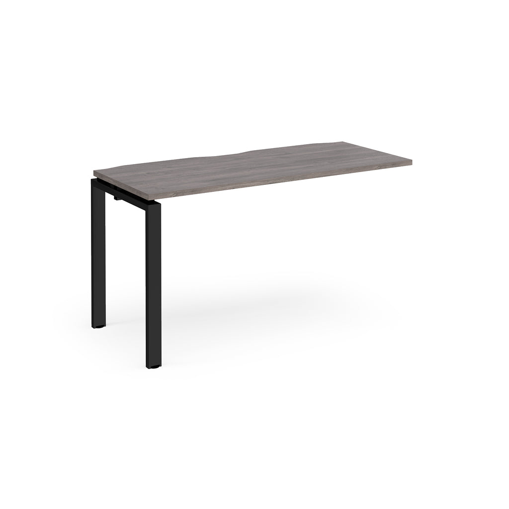 Desk add-on unit with grey wood-effect top and black metal frame on a white background
