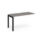 Desk add-on unit with grey wood-effect top and black metal frame on a white background
