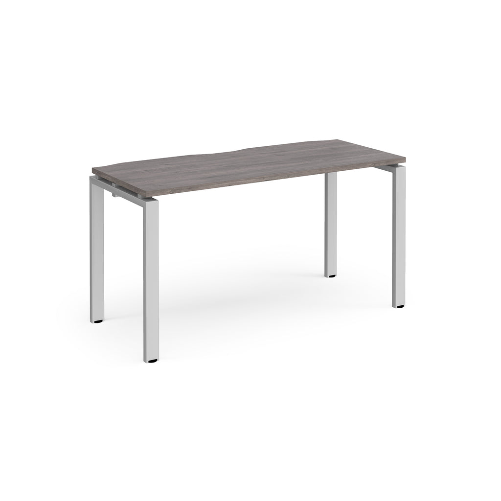 Rectangular desk with grey wood-effect top with silver metal frame on a white background