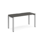 Rectangular desk with grey top with silver metal frame on a white background