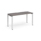 Rectangular desk with grey wood-effect top with white metal frame on a white background
