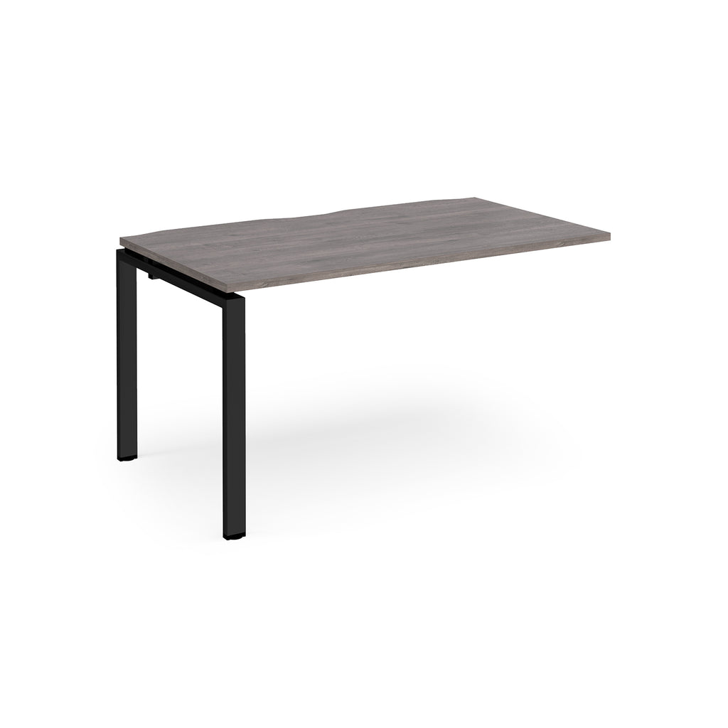 Desk add-on unit with grey wood-effect top and black metal frame on a white background