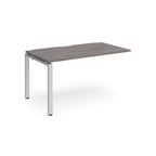 Desk add-on unit with grey wood-effect top and silver metal frame on a white background