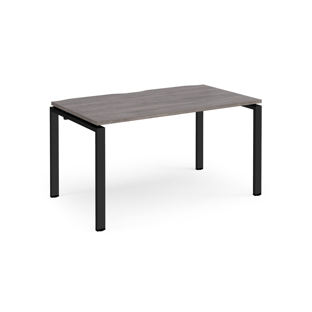 Rectangular desk with grey wood-effect top and black metal frame on a white background