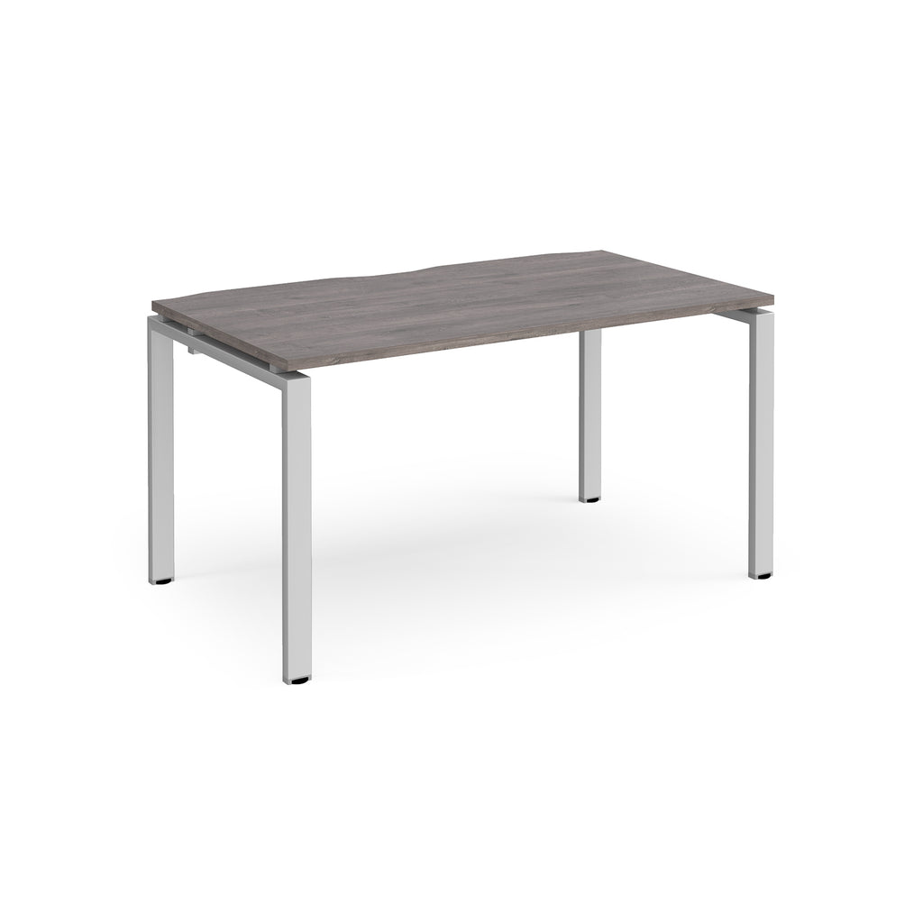 Rectangular desk with grey wood-effect top and silver metal frame on a white background