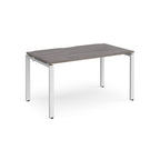 Rectangular desk with grey wood-effect top and white metal frame on a white background