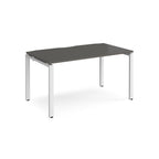 Rectangular desk with grey top and white metal frame on a white background