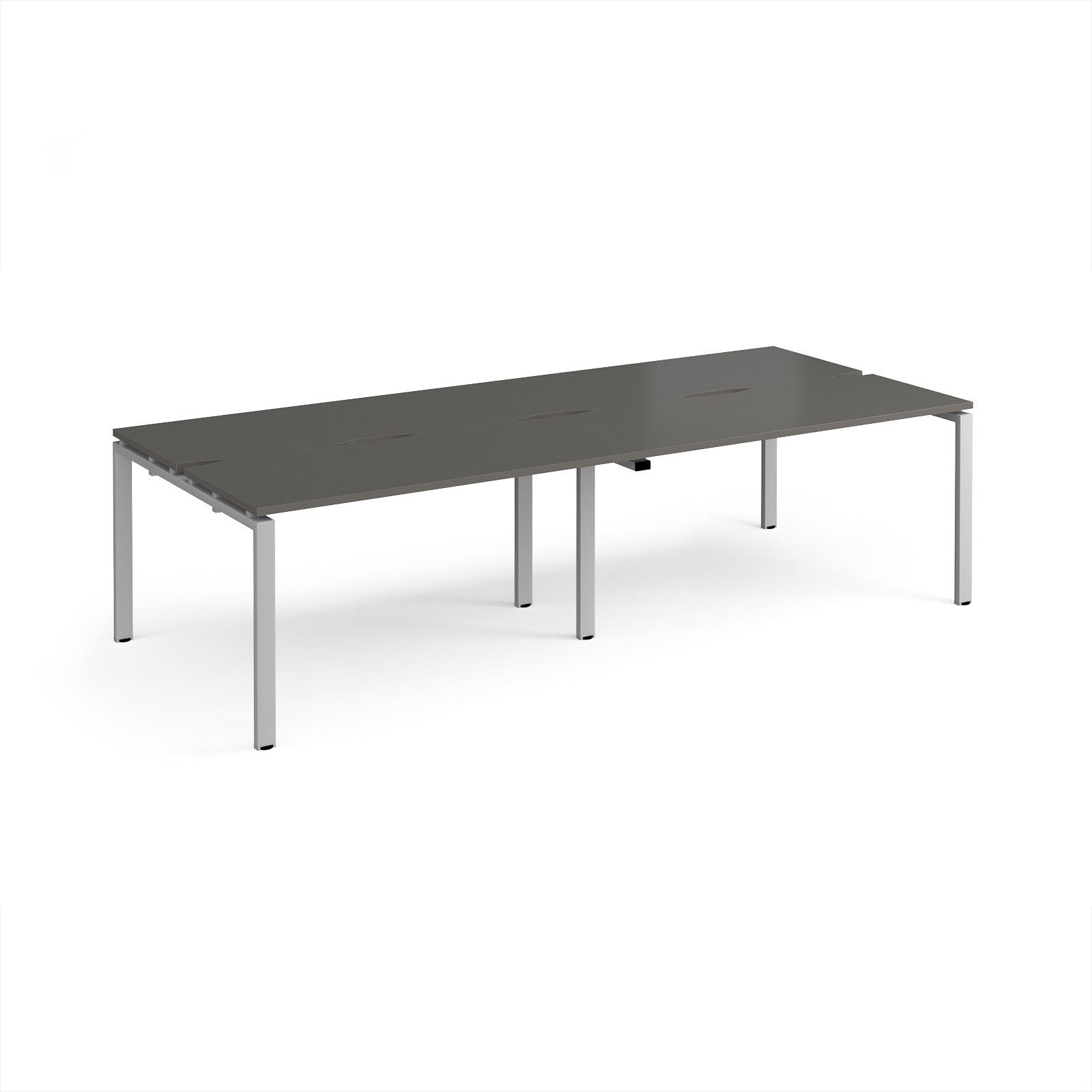 Four back-to-back desks with grey tops and silver metal frame on a white background
