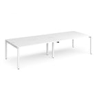 Four white back-to-back desks with metal frame on a white background