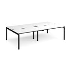 Four back-to-back desks with white tops with black edges and black metal frame on a white background