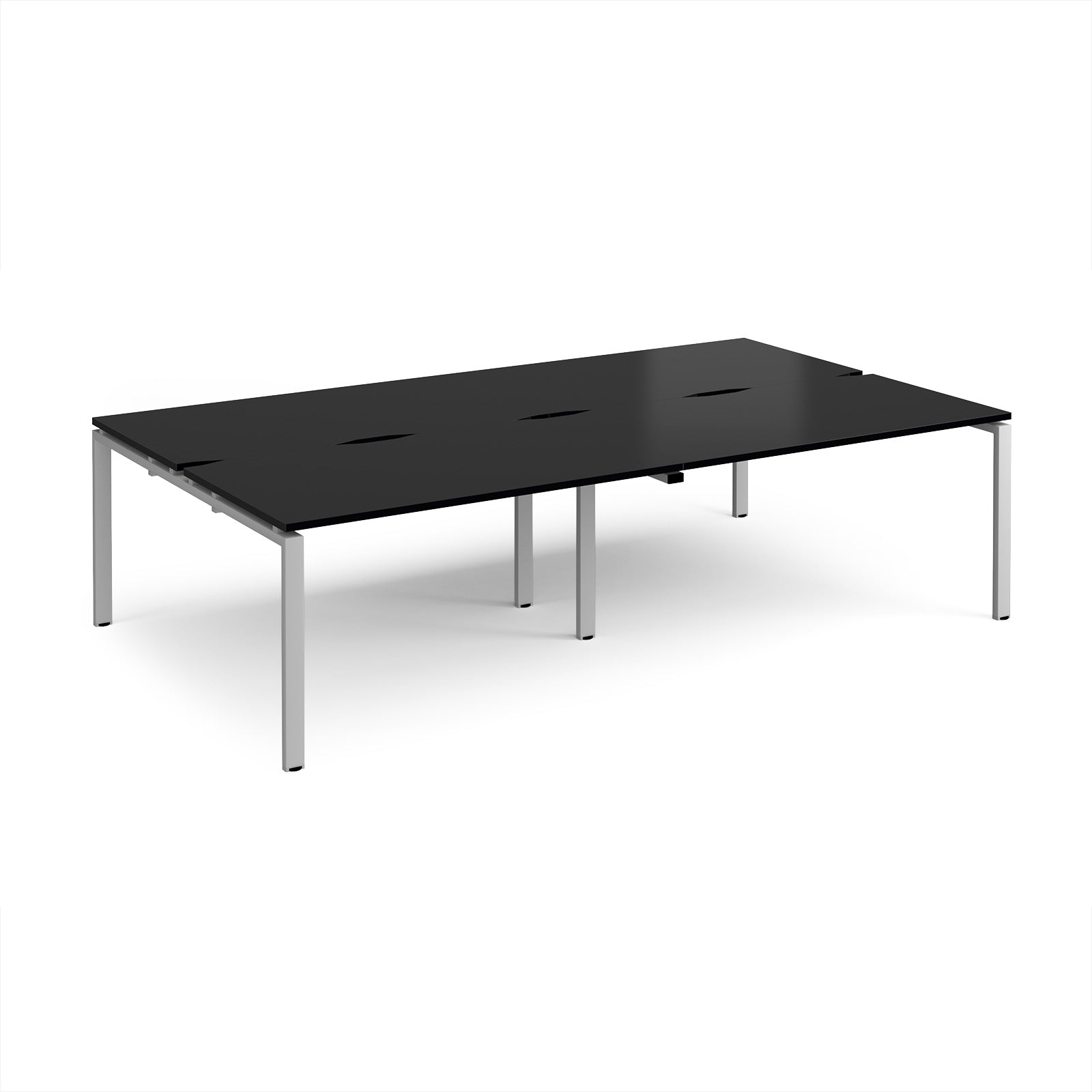 Four back-to-back desks with black tops and silver metal frame on a white background