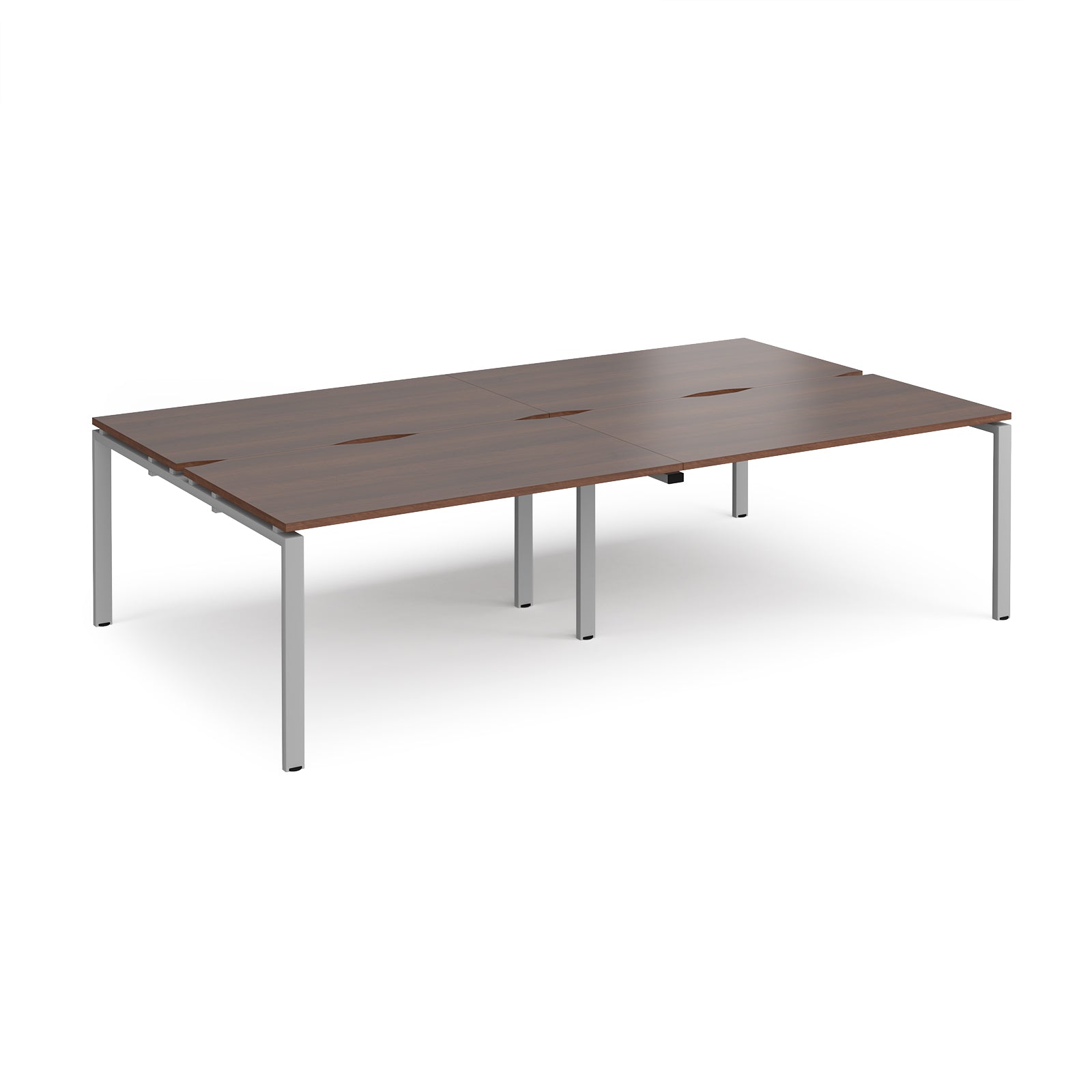 Four back-to-back desks with wood-effect tops and silver metal frame on a white background