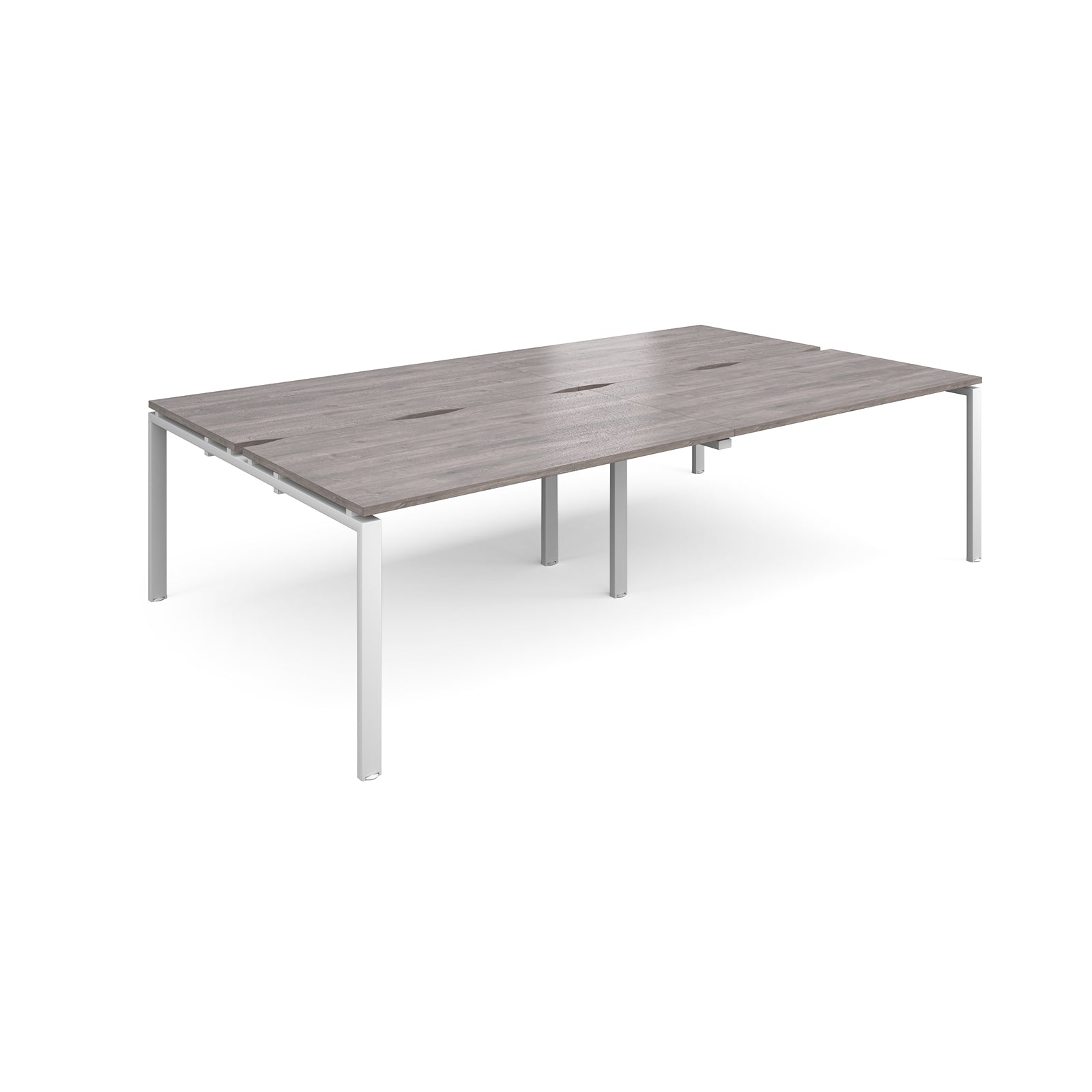 Four back-to-back desks with grey wood-effect tops and white metal frame on a white background