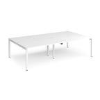 Four white back-to-back desks with metal frame on a white background