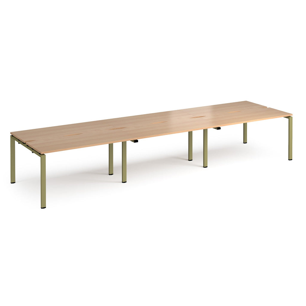Long back-to-back desk with wood-effect top and green metal frame on a white background