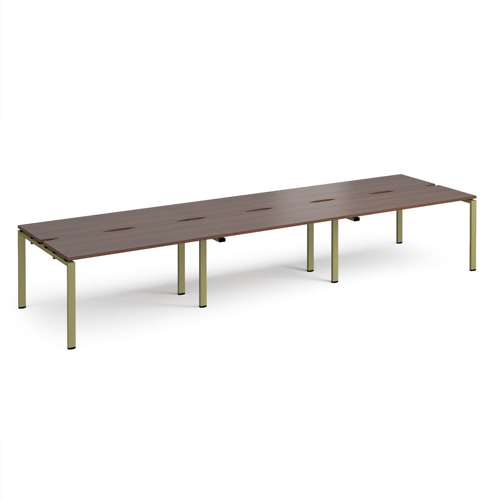 Long back-to-back desk with wood-effect top and green metal frame on a white background