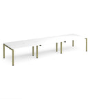 Long back-to-back desk with white top and green metal frame on a white background