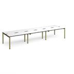 Long back-to-back desk with white top with black edges and green metal frame on a white background