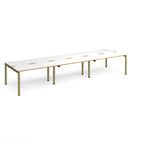 Long back-to-back desk with white top with wooden edges and green metal frame on a white background