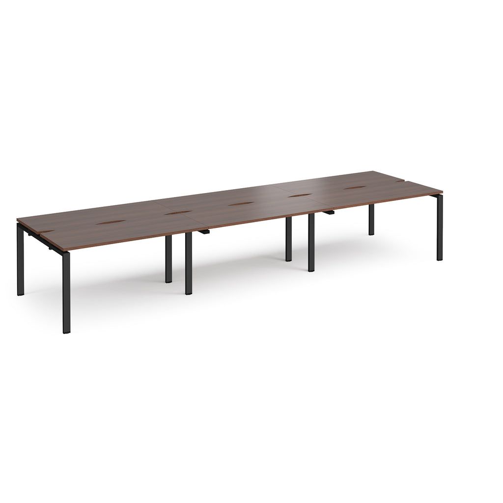 Long back-to-back desk with wood-effect top and black metal frame on a white background