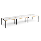 Long back-to-back desk with white top with wooden edges and black metal frame on a white background